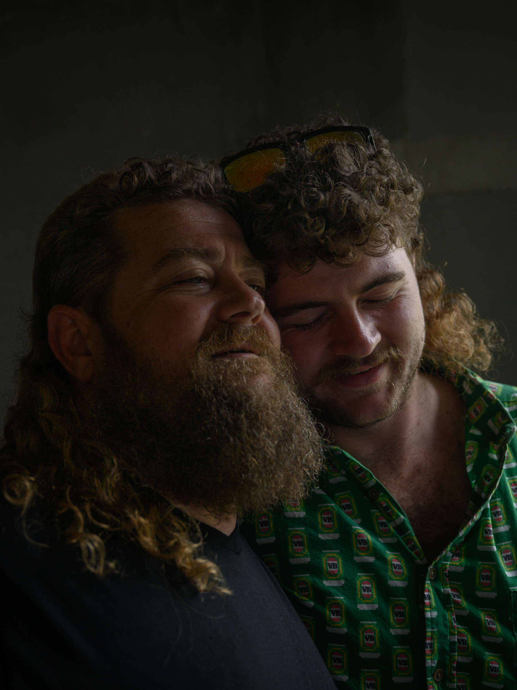 Intimate portrait of two men in soft window light — documentary photography by Matthew Abbott