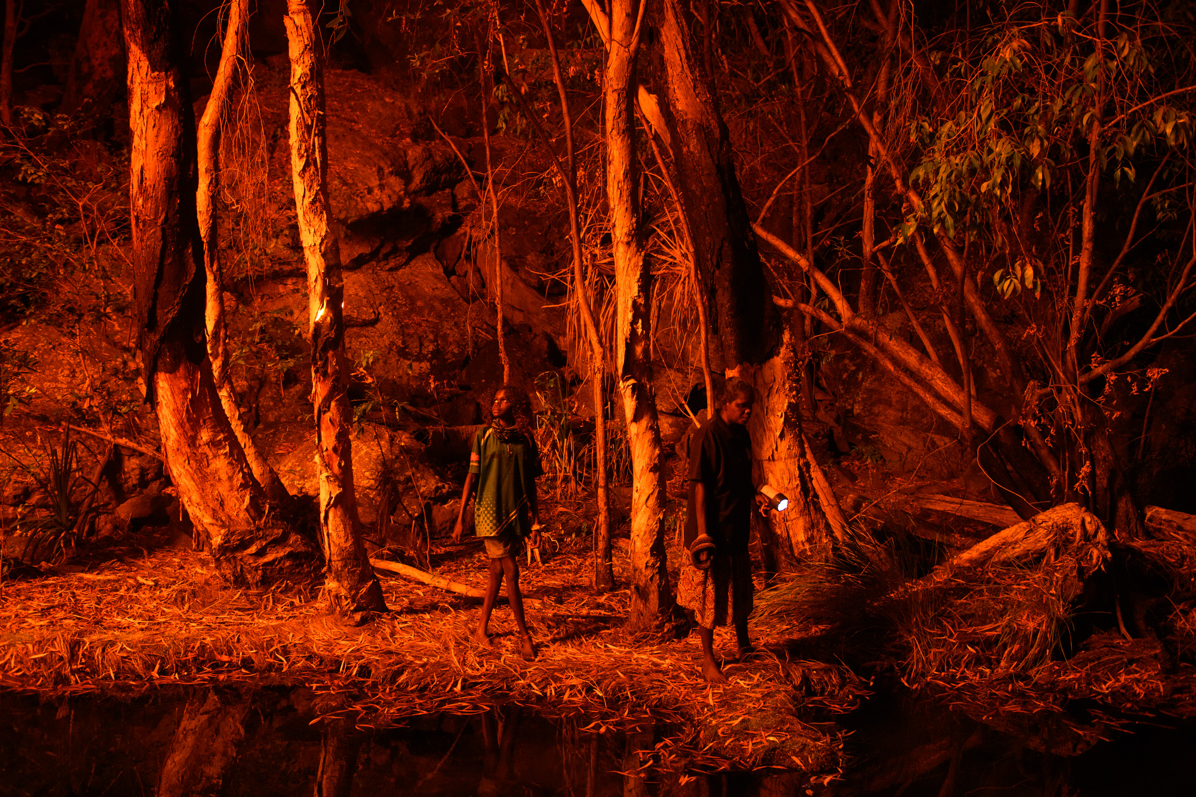Night cultural burn by torchlight — Aboriginal fire management, photographed for National Geographic by Matthew Abbott